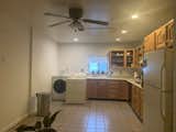 Before: The kitchen was previously at the rear of the house with one small window. The couple replaced it with a laundry room and powder bath, and swapped the living room in its place.