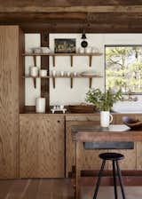 The oak chosen for the cabinetry was “one of those balancing elements between the original wood structure and the ceiling,” says lead interior designer Tina Schnabel.