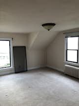 Before: The bedrooms felt small, with low ceilings, small windows, and awkward ceiling angles.