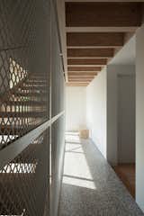 The middle floor hallway has terrazzo flooring and Douglas fir at the ceiling.