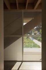 The metal mesh casts interesting shadows and allows sightlines to the front yard from the hall.