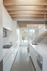 The large kitchen island and perimeter counter is covered in Lido Quartz. “We just wanted a big entertaining space, with a big kitchen, for everyone to enjoy, and not to be used by just us,” says Monika.