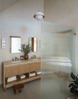 Primary Bathroom of Ditch Plains Residence by Oza Sabbeth Architects