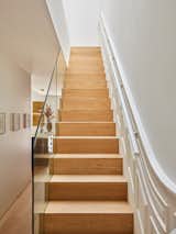 An enlarged skylight in the upstairs hall sheds light on the rebuilt staircase.
