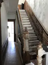 Before: The staircase down to the basement was capped and a garden level rental created on the lower level.