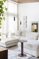 In the TV area, Bruce had the couple’s existing couch recovered in boucle by Hertex, and joined it with a rug from Lorena Canals and side table from Lemon.