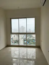 Before: The daughter’s room is the smallest, but needed to accommodate floorspace for playing with friends, so the designers wrapped the edges in built-in furniture and storage.