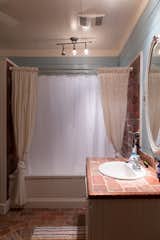 Before: Bathroom in Hill Country Cabin by Jobe Corral Architects