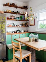 Wall shelving is made of wood salvaged from other parts of the house.