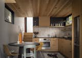 David likes to cook and entertain so the architects designed a full-scale kitchen with Forbo Marmoleum flooring, white oak cabinets, ceramic tile backsplash, and Richlite counters.