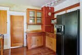 Before: The couple kept the existing cabinet boxes and counters, and had new cabinet doors made to match.