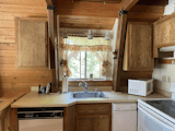 The upper cabinets were removed to expose more of the wood walls.