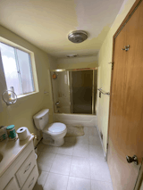 The couple swapped out the finishes and added a window to the shower for more natural light.