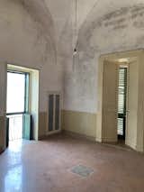 Before: The floors, walls, and ceiling were similarly redone in this room.