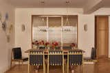 The extendable dining table is custom designed by Sugarhouse and fabricated by Elwood Design Co. The chairs are vintage Egon Eiermann purchased from Morentz Gallery, and the over table lights are Bert Frank.