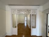 Before: To save this existing fretwork, the design team converted it to a double-door entry to the primary bathroom.