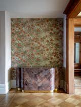 The wallpaper in the niche is a remnant from Laura's childhood home. The paint color is "Tissue Pink