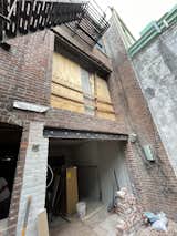 During: A big part of the budget was enlarging the openings in the rear facade for the glass doors in both units.