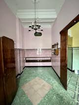 Before: "Due to the humid climate in Valencia, old houses often have ceramic wainscoting (‘arrimaderos’). Tiles cover the lower section of the interior walls to prevent any marks from capillaries rising from beneath," says David. The patch on the floor marks where it had bubbled up from trapped moisture.