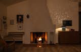 The wood-burning fireplace is a popular place for the family to gather at the end of the day, with the Lin Table Lamp evoking the night sky.