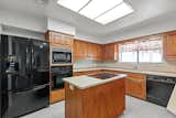 Before: The kitchen was gutted but the appliance layout kept.