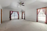 Before: The couple replaced the flooring and fixed the ceiling line in this room.