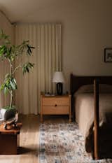 The Orion Side Table are by Muhly. The wall color throughout is Mascarpone, by Benjamin Moore.