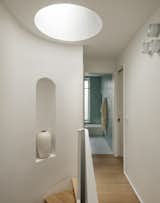 A skylight sends light down the new staircase. It is operable, which Kwame and Tamara like for ventilation.