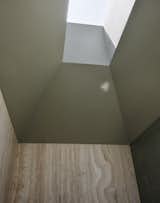 The ceiling was "sculpted to angle up to the skylight,