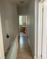 Before: Upstairs Hallway of Quincy House by Office of Architecture
