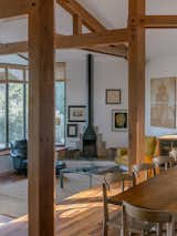 In the living room, the glass coffee table is designed by Miguel Milá, and the Cadaqués armchair by Correa &amp; Milá is a bespoke design that originated with this house.