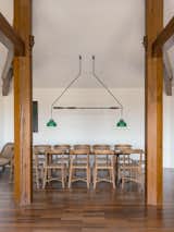 Gr-os Architects designed a custom light over the table, produced by Jaque Barcelona.