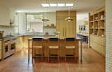 Yuan added skylights throughout the house to bring more light into the interior, including this one over the central island, which also has pendants by In Common With. The floors are by D’Hanis Terracotta Tile.