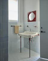 "We powder coated all of the hardware, to give it this fresh vibe, and Office of Tangible Space found the vintage Ikea mirror that perfectly matched,