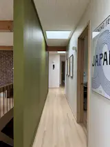 The green paneling continues down the hallway. The skylights were original.