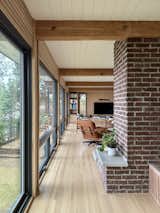 The couple added a ledge to the side of the fireplace for display or possible seat.