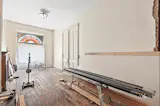 Before: The couple had the historic stained-glass window restored. The wood floors had to be replaced.
