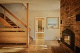 The door to the sunroom was kept, as well as the brick fireplace.