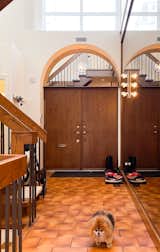 Before: Architect Bernard Rasch designed this modernist rowhouse, one of six, in 1977. Richard and Nicole Kuchinsky bought this one in 2018, with the goal of remodeling it for their family while keeping the distinct features, like the wall of smoked glass in the entry.