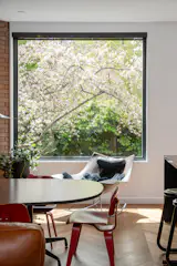 The architects replaced the existing window with a picture window to clean up sight lines into the backyard.