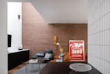 The brick wall was existing, and the architects restored the skylights above.
