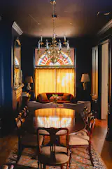 A chandelier and rug sourced on Facebook Marketplace join the dining set inherited from Ellie's parents.
