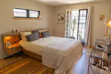 Eric bought the bed second-hand. It was in terrible condition, so he refinished it and rebuilt the drawers. The Le Corbusier chairs were bought second-hand on Kaiyo.