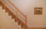 Eric restored the red oak stair treads and risers, then milled and built the new handrail from salvaged red oak.