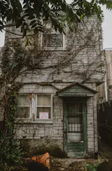 Before: The porch roof was removed and the siding replaced.