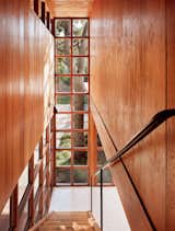 The original yellow pine walls and metal handrail were refinished.