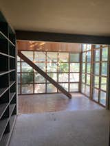 Before: A painstaking effort was made to bring all of the windows up to code in the stairwell, by swapping in tempered glass panels.