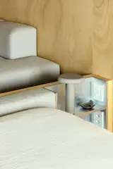 A built-in side table with charging stations.