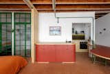 Arkitito Arquitetura opened up the wall between the kitchen and living room.