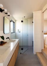 In the bathroom, Kevin specified large format porcelain floor tile with staggered 2x8 ceramic Clé Tile on the walls.